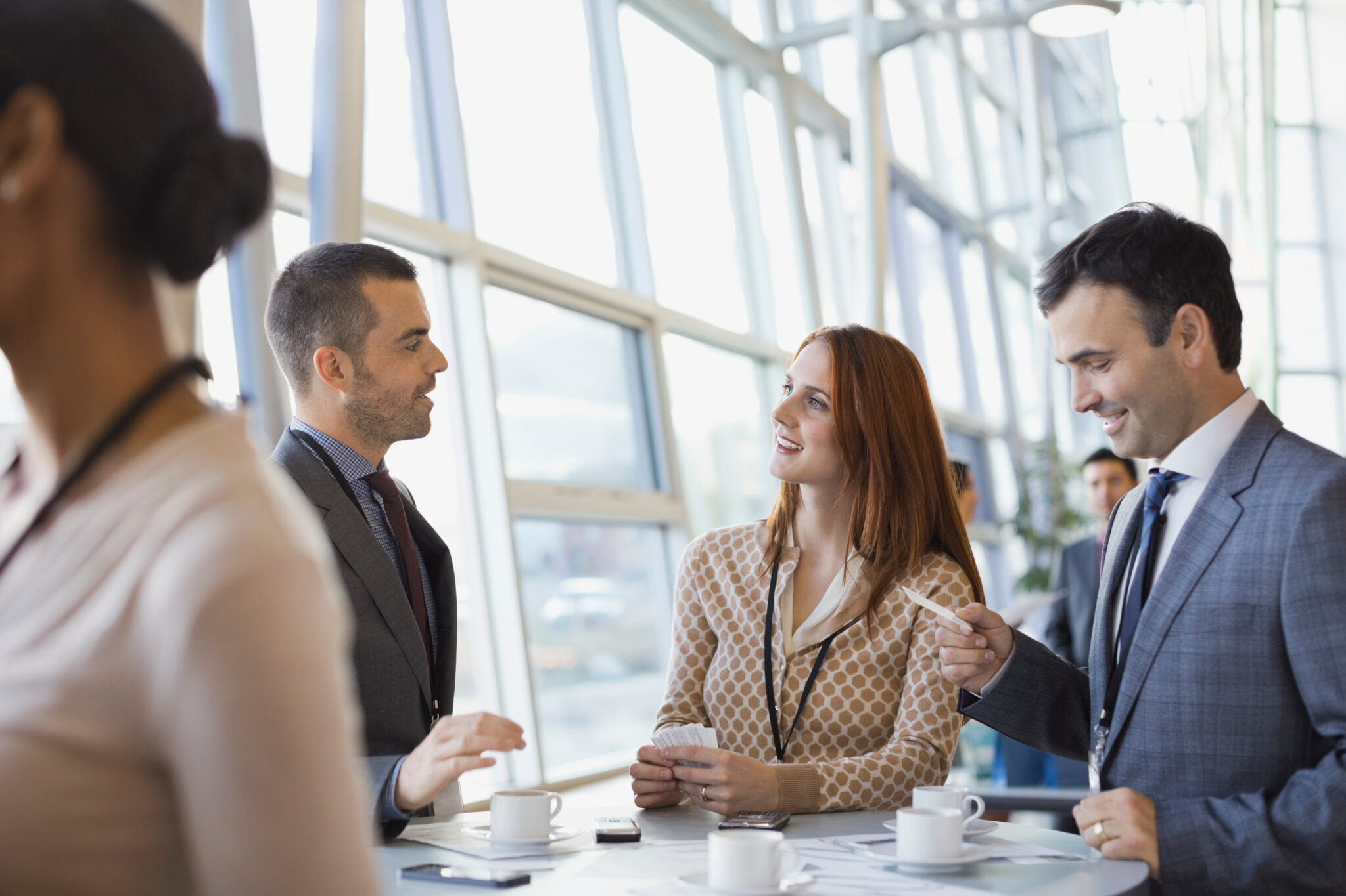 Business people exchanging business cards at conference